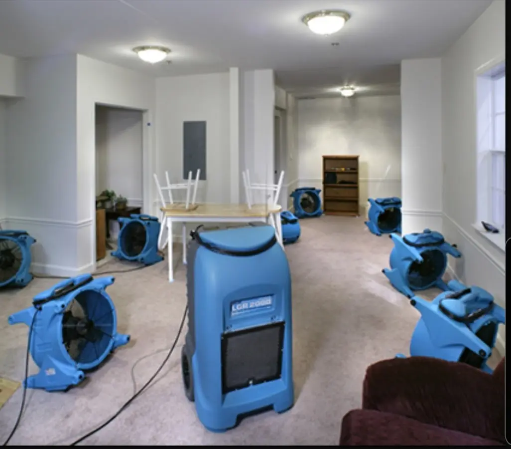 Air movers and dehumidifier setup for Water Damage Restoration in East Riverdale